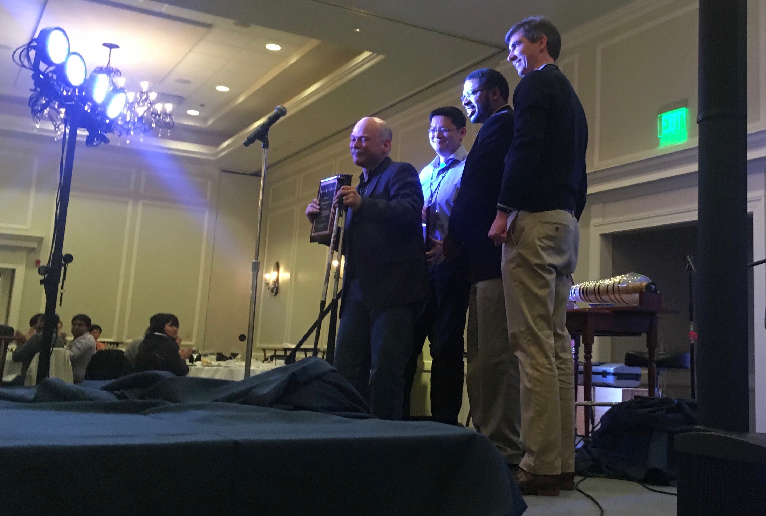 Kubi and co-authors accepting their Most Influential Paper award for the OceanStore paper.