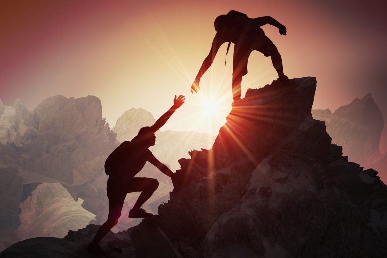 Help And Assistance Concept Silhouettes Of Two People Climbing On 